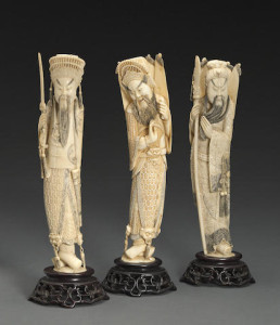 A group of three carved and tinted ivory martial figures